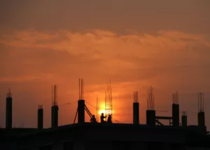 https://www.pexels.com/photo/silhouette-of-men-in-construction-site-during-sunset-176342/